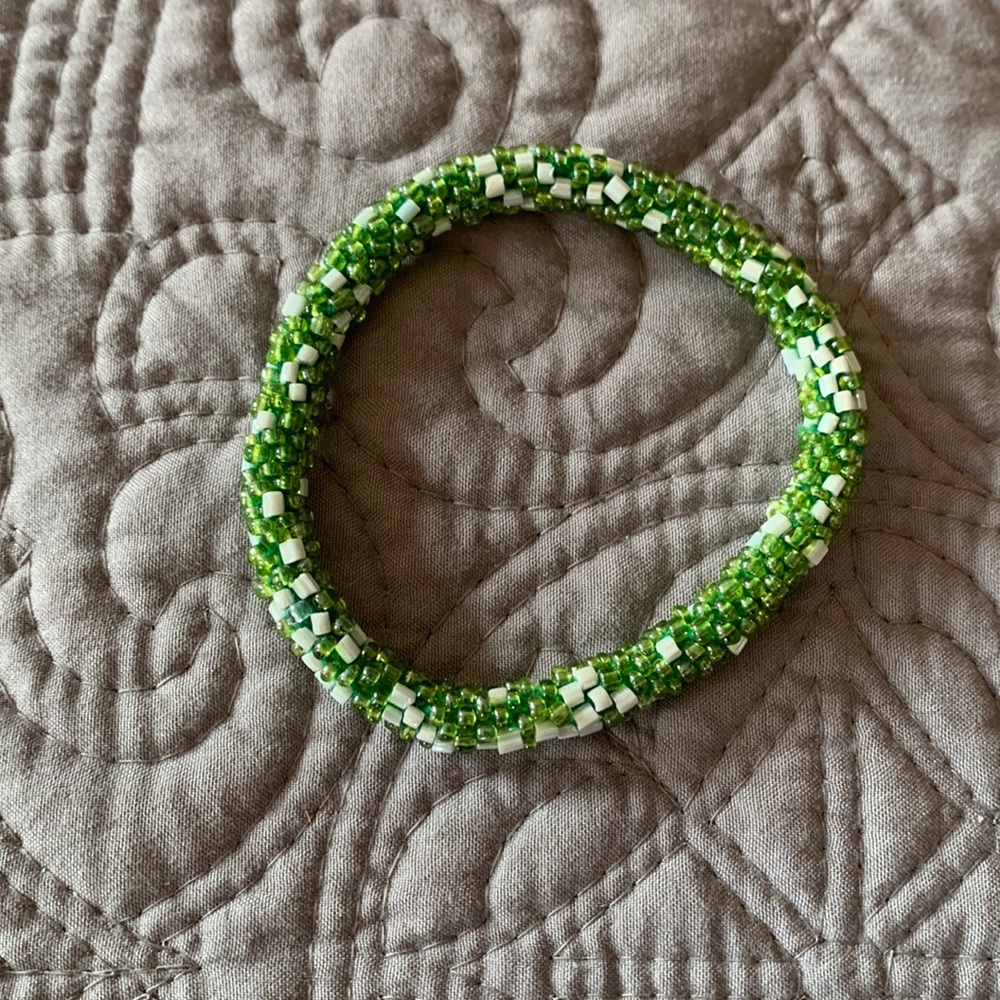 Green and white beaded bracelet